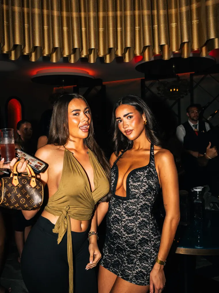 Two guests posing at the ME&U launch
